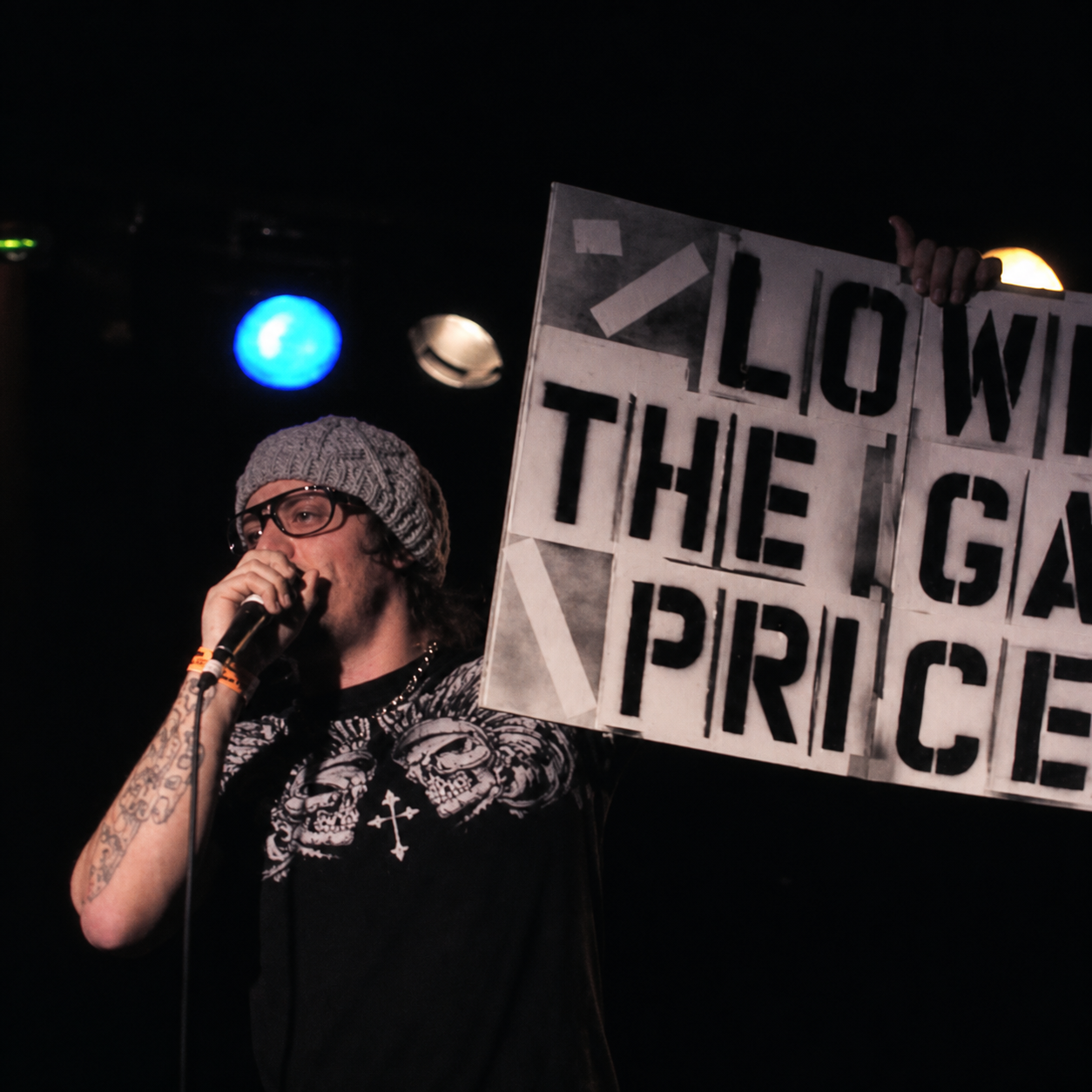Bear the Astronot performing beside a handmade Know the Game Price sign